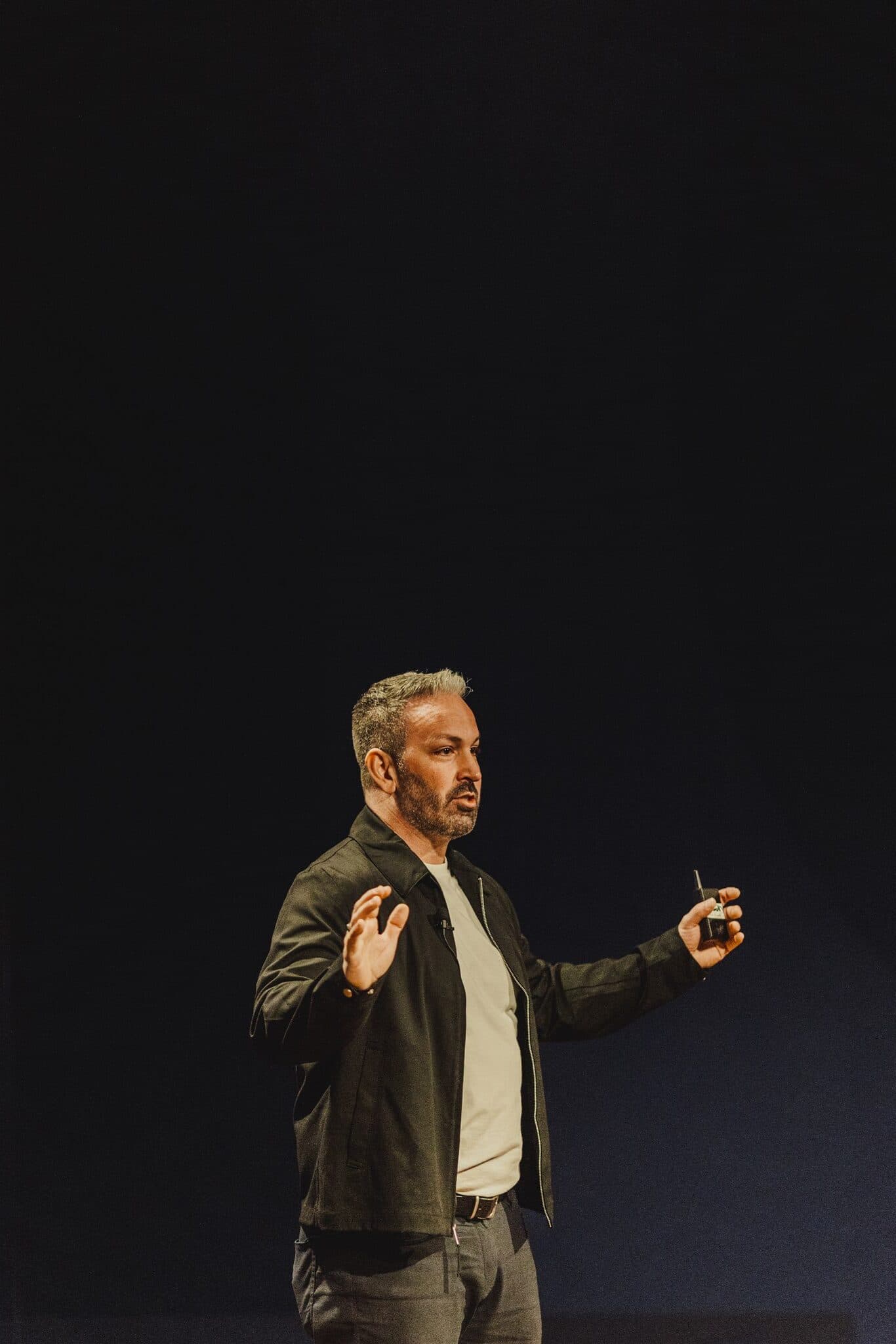 Dr. Alain Desaulniers speaking on stage at LUX Talks
